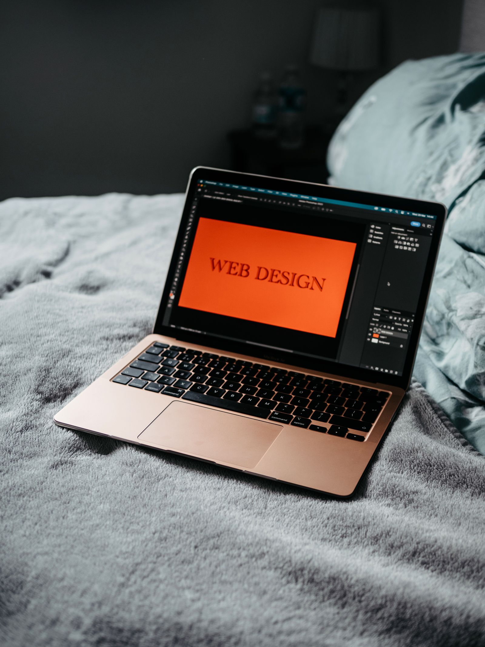 A laptop showing a web design project